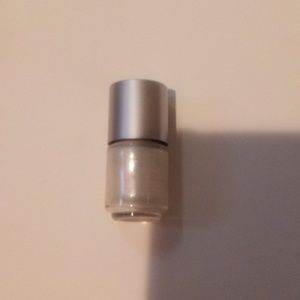 A silver glittery nail polish filled never used